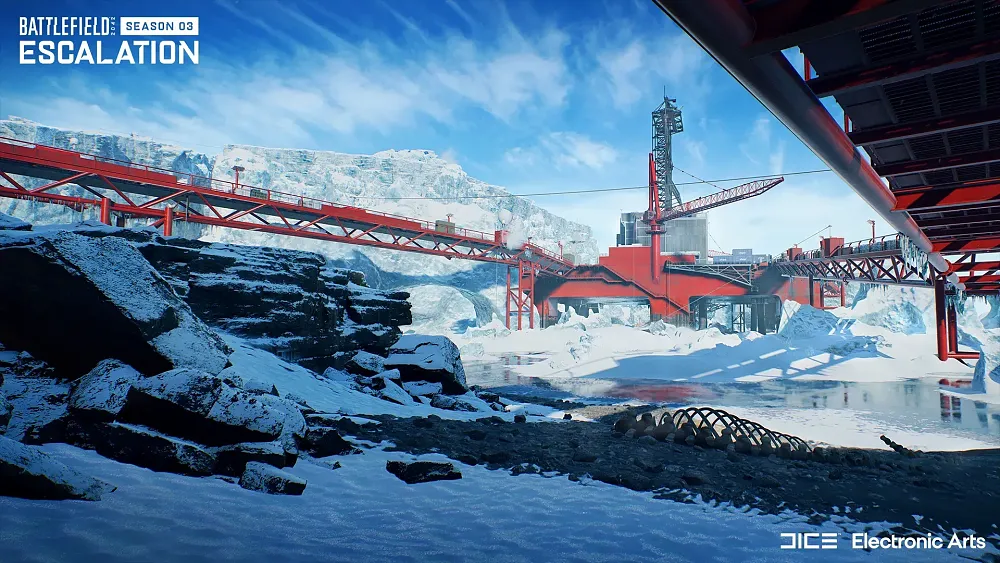 Image showing a large red oil rig in a snowy and icy environment. There are tall ice shelves and snow covered rocks surrounding the rig.