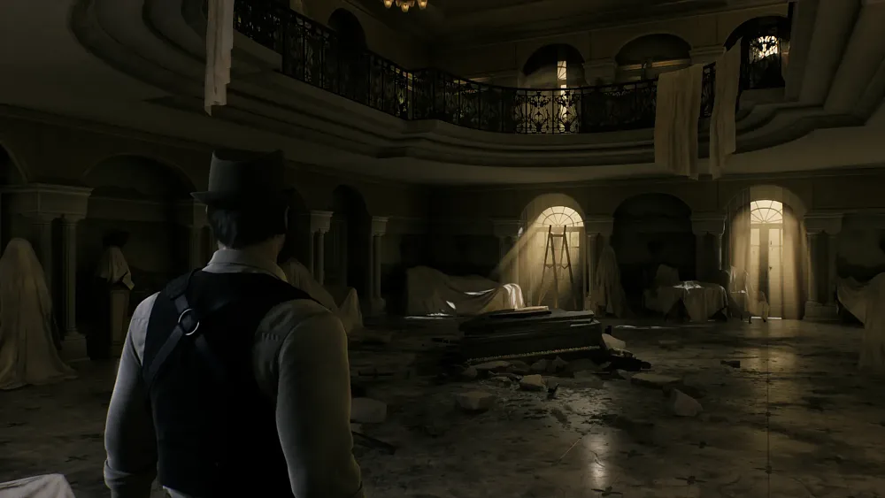 A male character standing in a dim entryway to a large mansion.