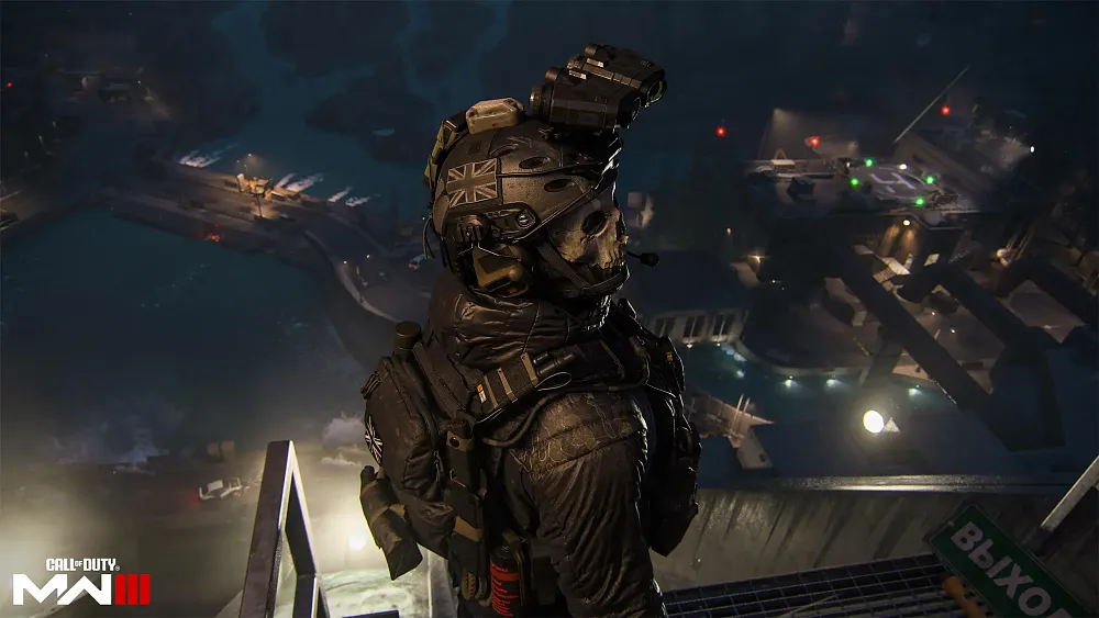 A soldier with a skull mask standing far above what looks like some sort of facility.