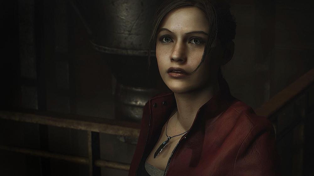 Close up of a woman in a red jacket looking moderately surprised at something off screen.