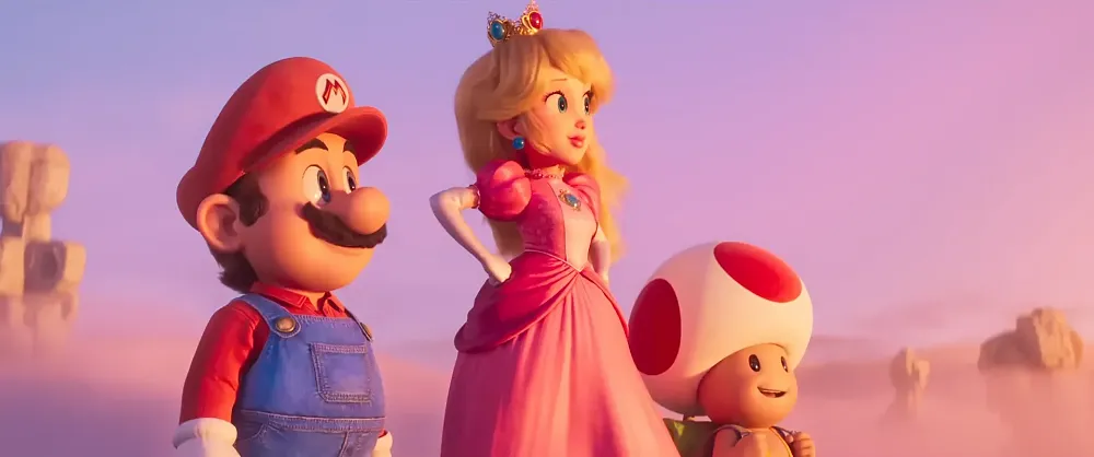 Screen grab from the new Super Mario Bros. Movie trailer featuring Mario, Princess Peach, and Toad looking off to the right
