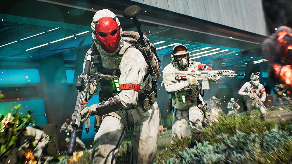 Soldiers in white and red gear holding various assault weapons storming the battlefield of war.
