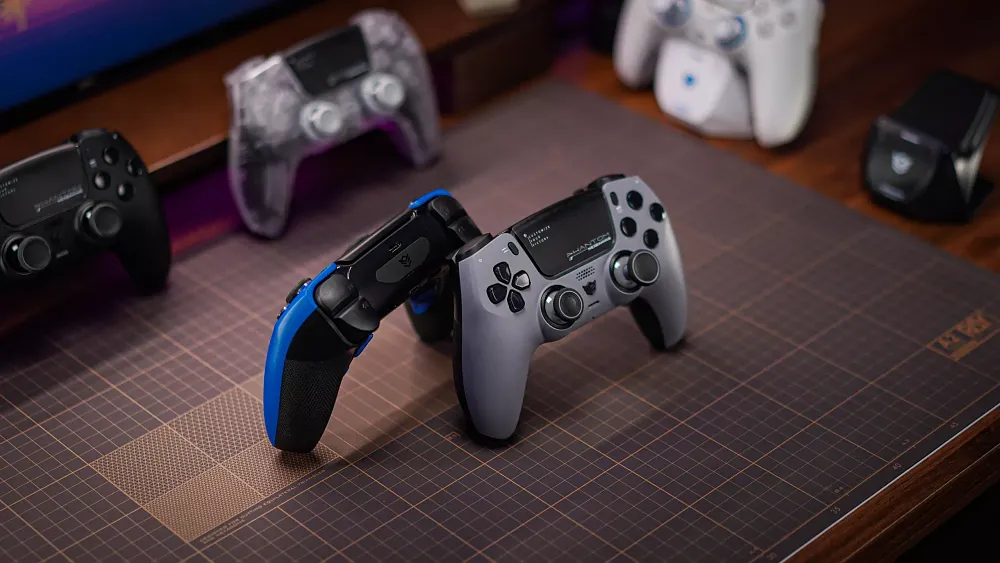 Different colors of a PlayStation 5 controller displayed on a table.