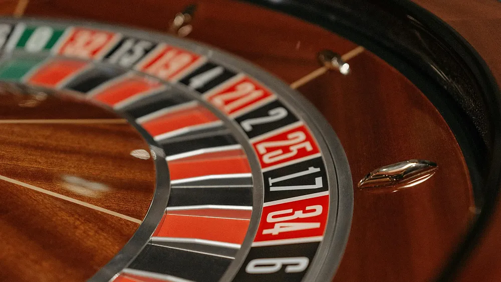 A closeup of a part of a roulette wheel. Image via pexels.com.