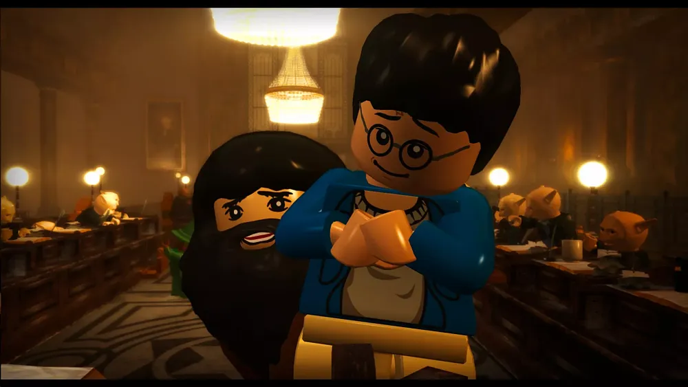 A LEGO version of Harry Potter held up by a LEGO Hagrid.