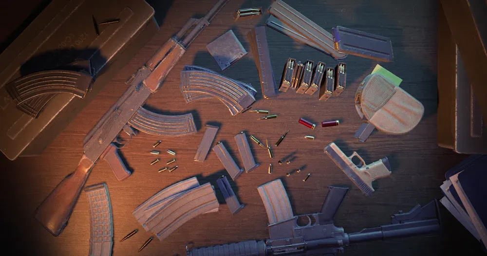 A variety of Counter-Strike 2 weapons, ammo, and ammo magazines laying on a table.