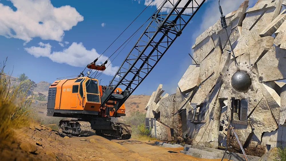 A wrecking ball demolishing a stone building.