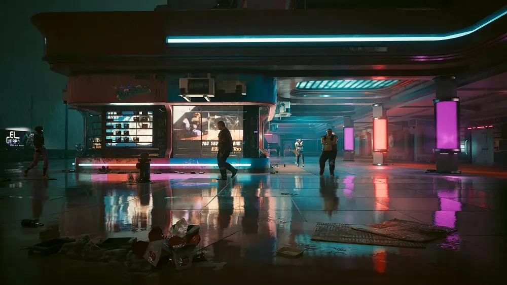 A night time scene looking at the front of a building. Neon lights reflect off the wet ground. People in this cyberpunk setting are shuffling about.