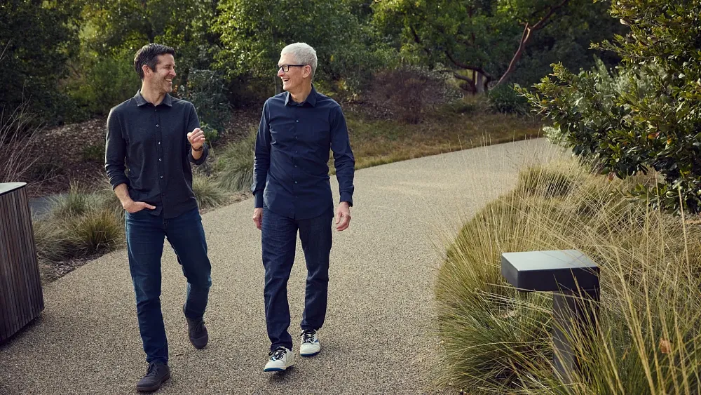 The upcoming Apple CEO John Ternus walking alongside the current CEO of Apple Tim Cook.