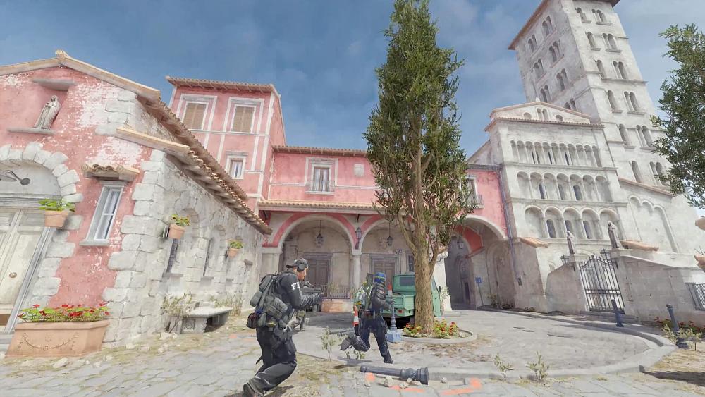 Law enforcement running through some sort of a European looking villa.