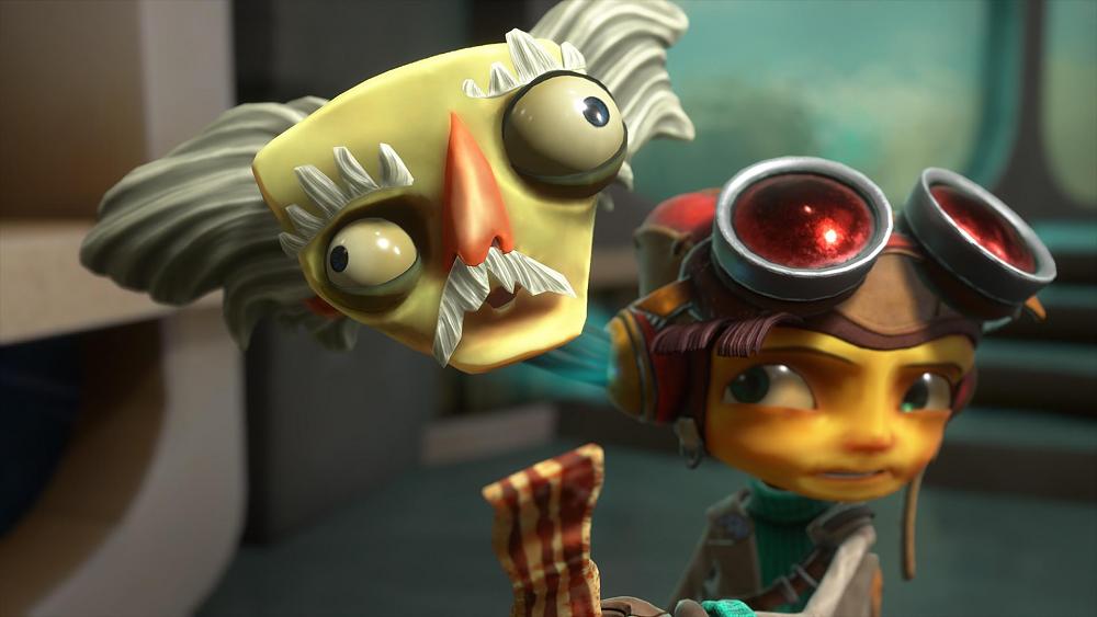 Screenshot from Psychonauts 2 showing a floating head of an old man next to a young adult who is wearing goggles and apparently holding bacon.