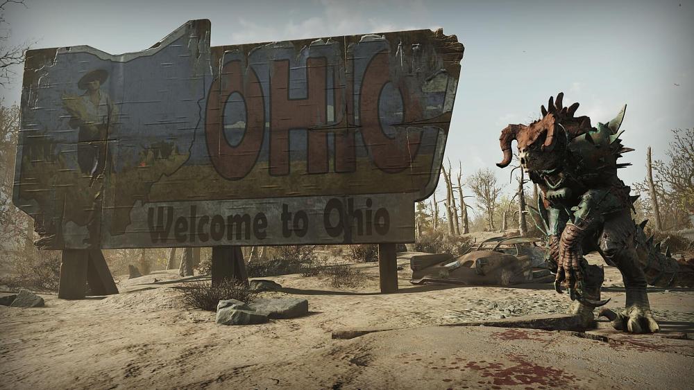 A large beast standing next to a sign that says, Welcome to Ohio.