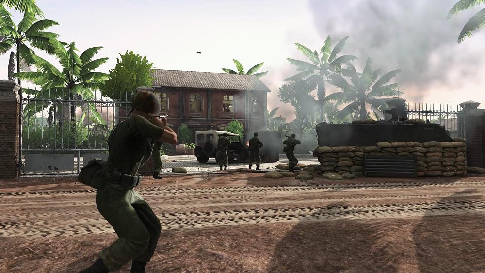 US soldiers in Vietnam firing at a building in the jungle.