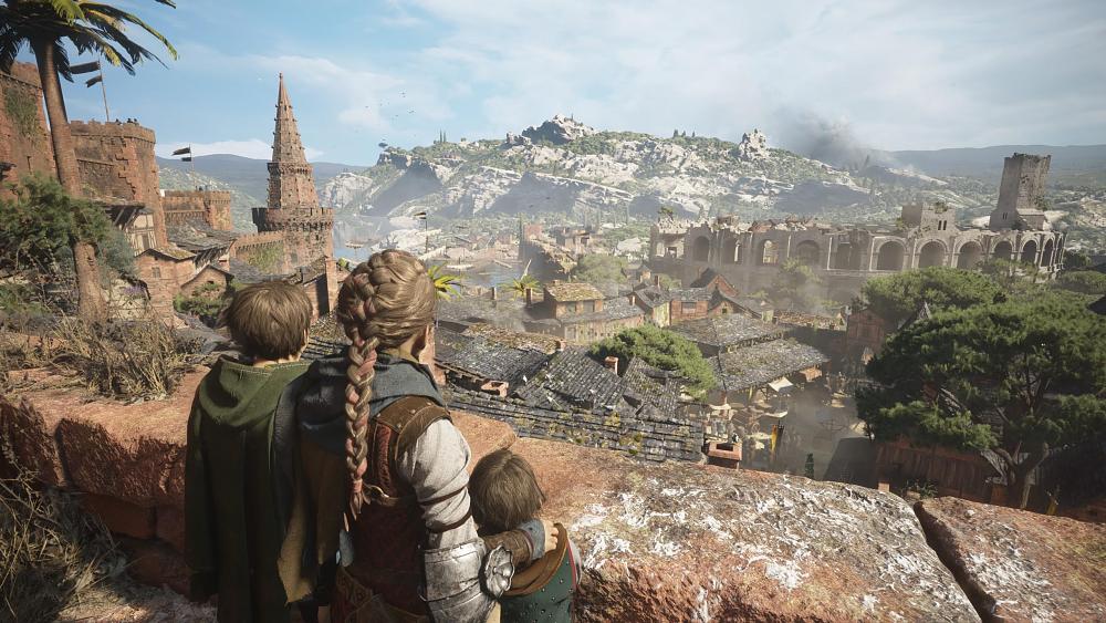 Image showing three children (2 boys and a girl) looking out over a wall at a medieval town. A large coliseum can be seen on the back edge of the town and beyond that rocky hills make up the landscape.