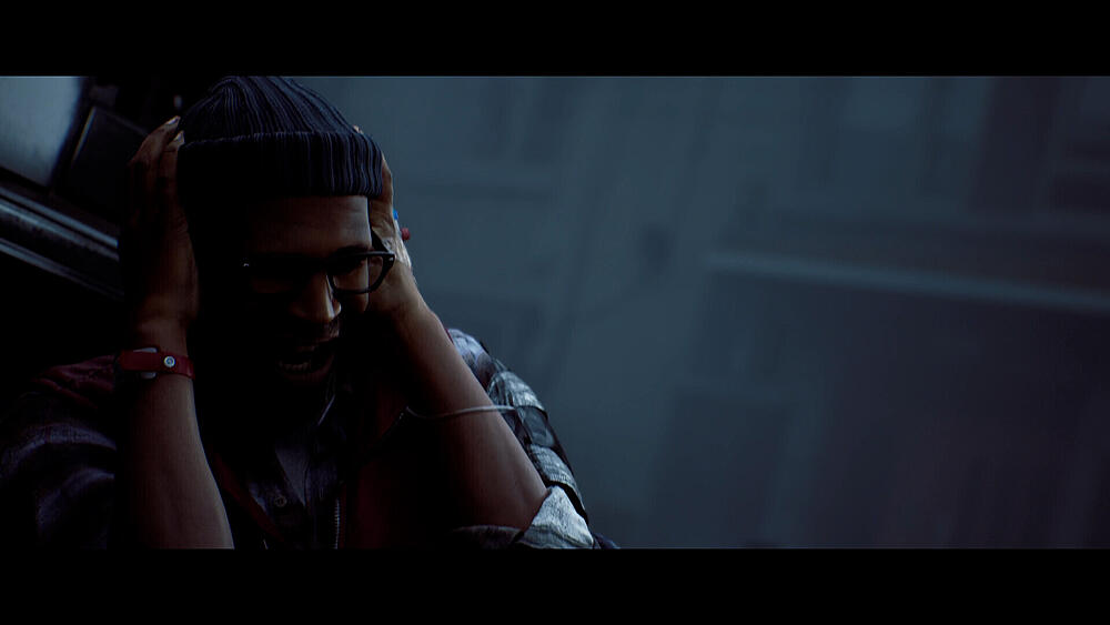 A man cowering in either pain or fear.