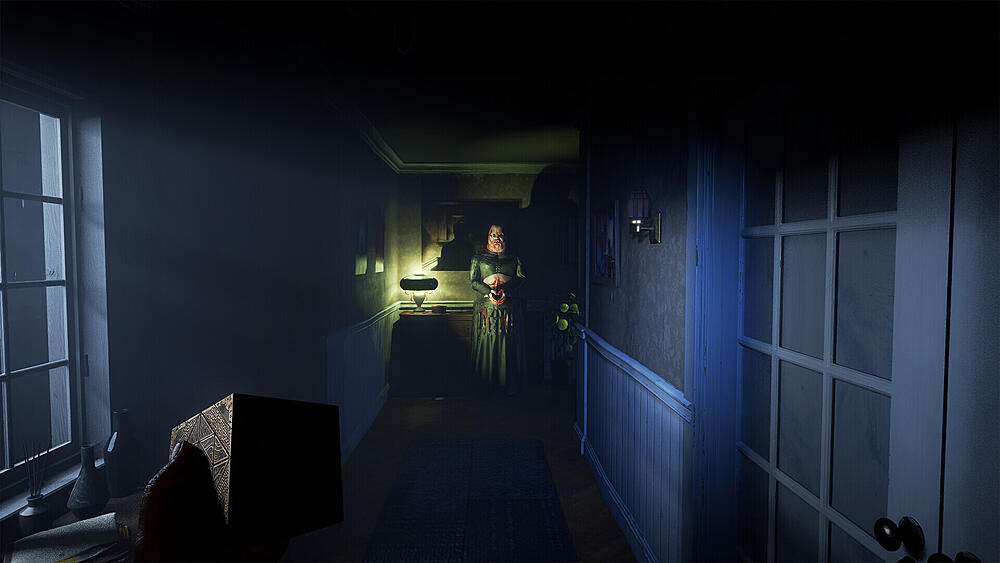 A fat human-demon standing at the end of a darkened hallway. Viewpoint is from someone who is holding a cube in their left hand.
