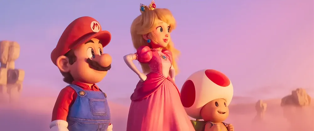Screen grab from the new Super Mario Bros. Movie trailer featuring Mario, Princess Peach, and Toad looking off to the right