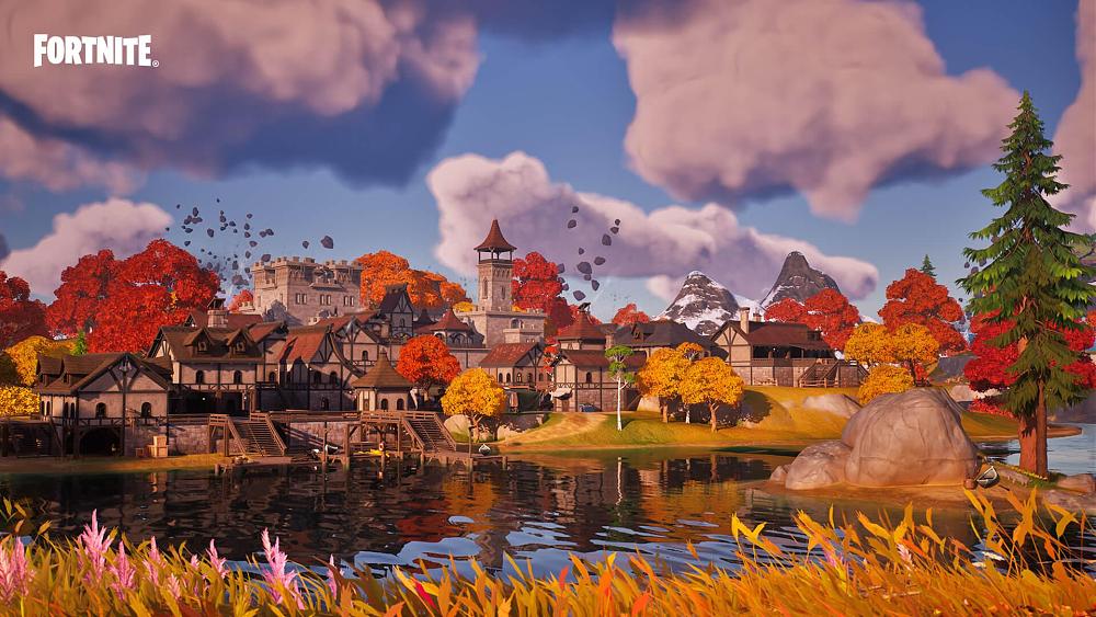 Image from Fortnite showing a medieval style town next to a pond