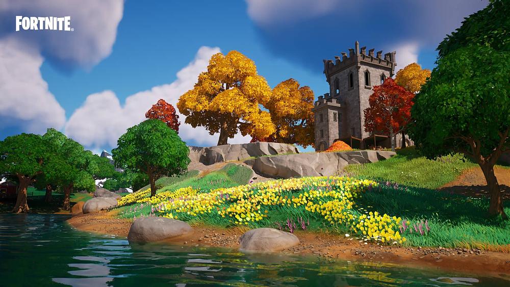 A scenic screenshot with a small river, yellow flowers in a field, some rocky ledges, and a castle tower in the background