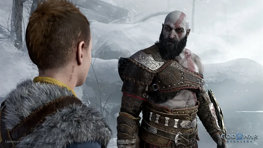 Screenshot of a bald ashen man named Kratos looking angrily towards his son that stands in the foreground