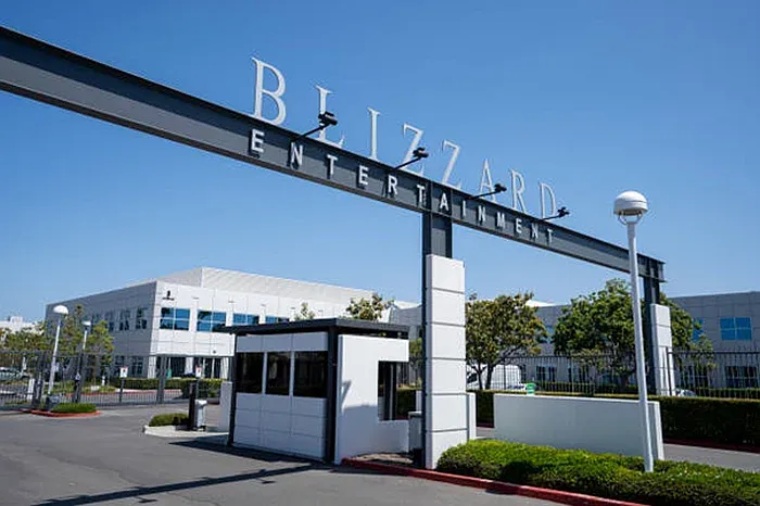 Front entrance to Blizzard HQ with a security booth, roads, and some office buildings in the background