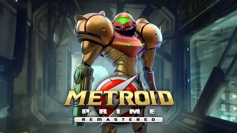 Metroid Prime Remastered. A person with bulky gold and red armor with a weapon attached to their arm stands in a metal hallway.