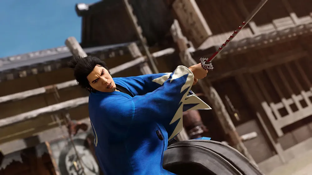 A samurai wearing blue swinging a samurai sword.