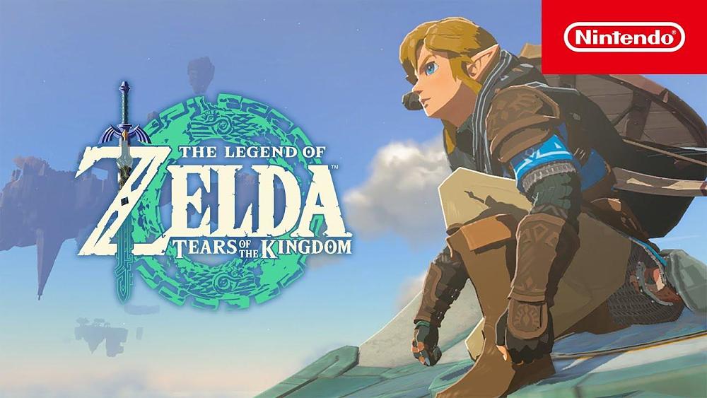 Text: The Legend of Zelda: Tears of the Kingdom. Nintendo. Image: Link kneeling down on a rock looking at a distant floating island.