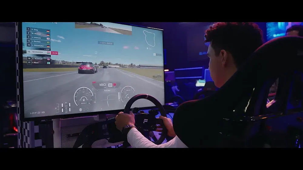 Screen grab from the Gran Turismo movie trailer showing someone playing the Gran Turismo game.