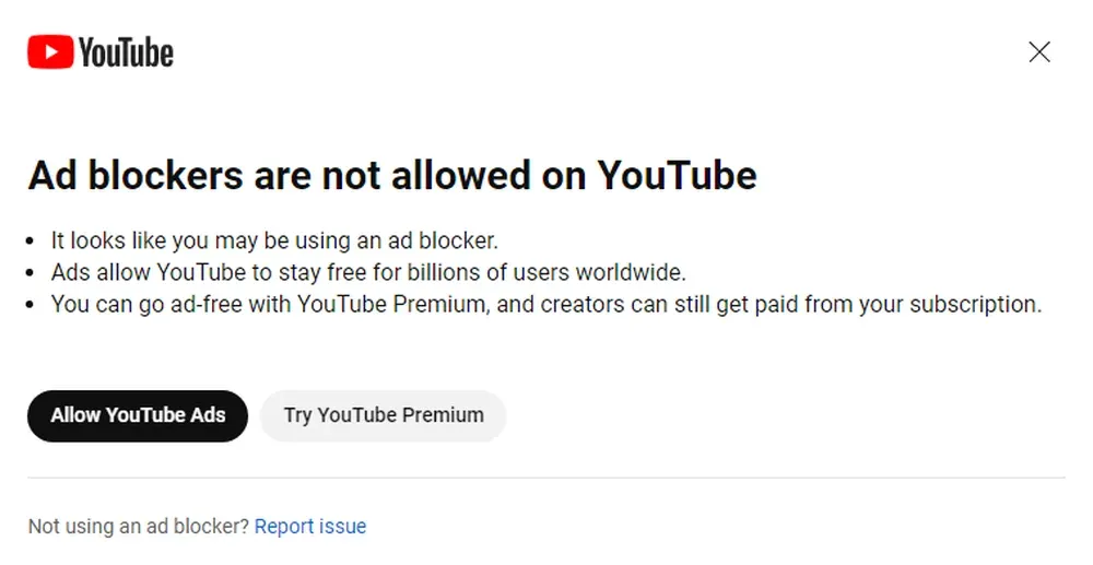 Popup from YouTube saying that they are banning the use of ad blockers and that users wanting an ad-free experience should turn off the ad blocker or subscribe to YouTube Premium.