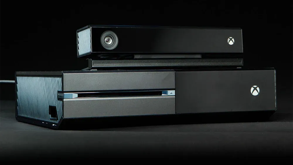 An Xbox One console with Kinect placed on top.