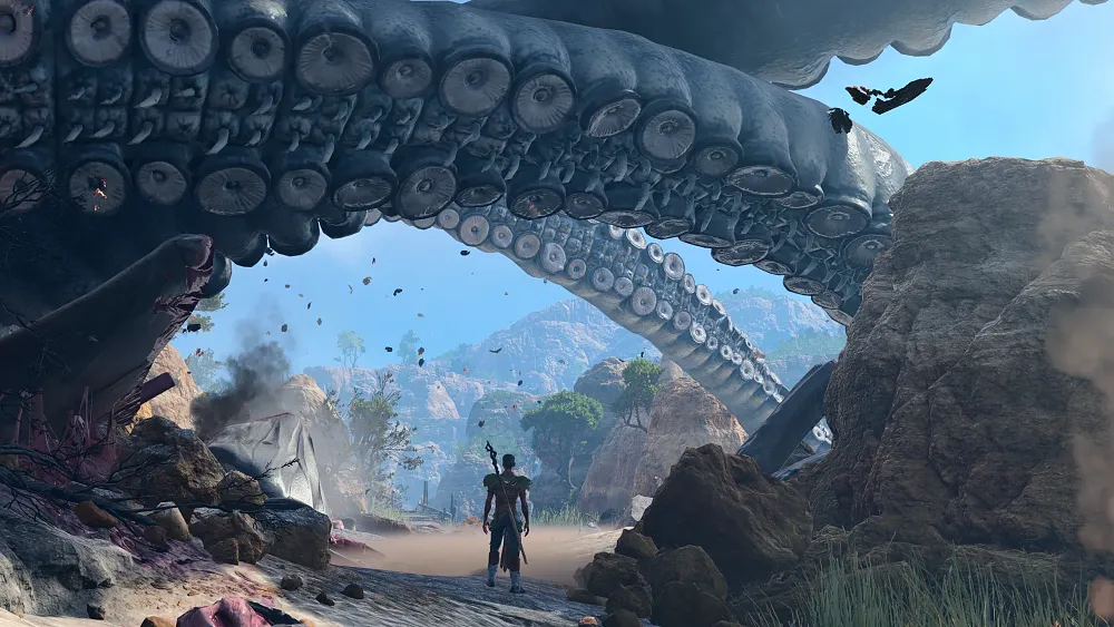 Giant tentacle above a character standing on a beach.
