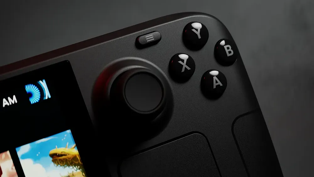 Closeup of the new Steam Deck OLED handheld PC showing a corner of the screen and the top right section of the device.