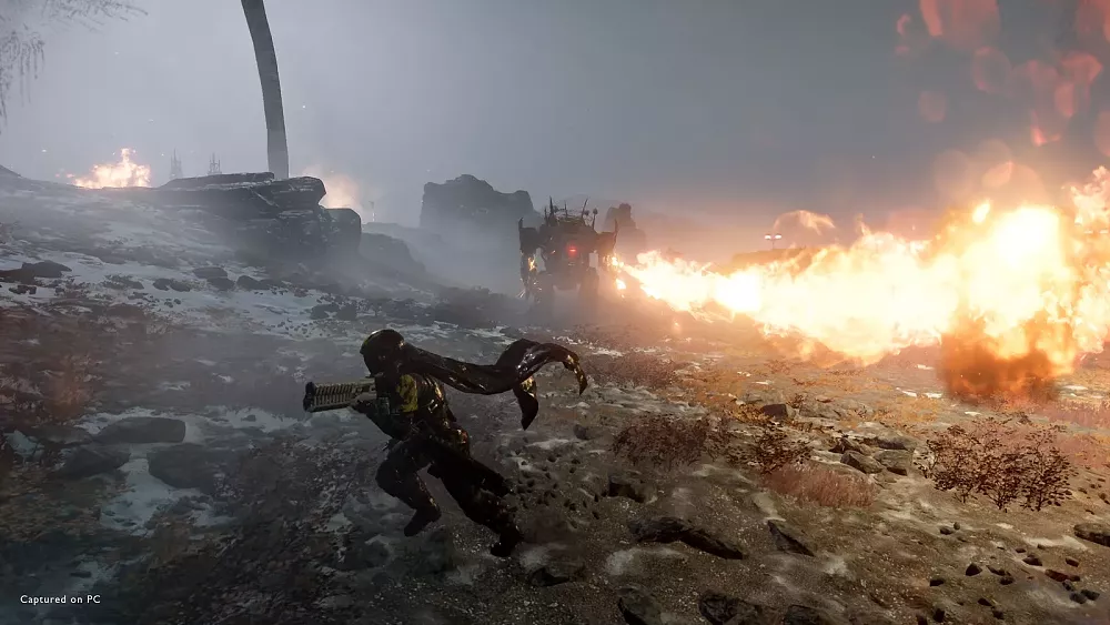 Screen showing a soldier dashing away from a flamethrower shot out by a mech.