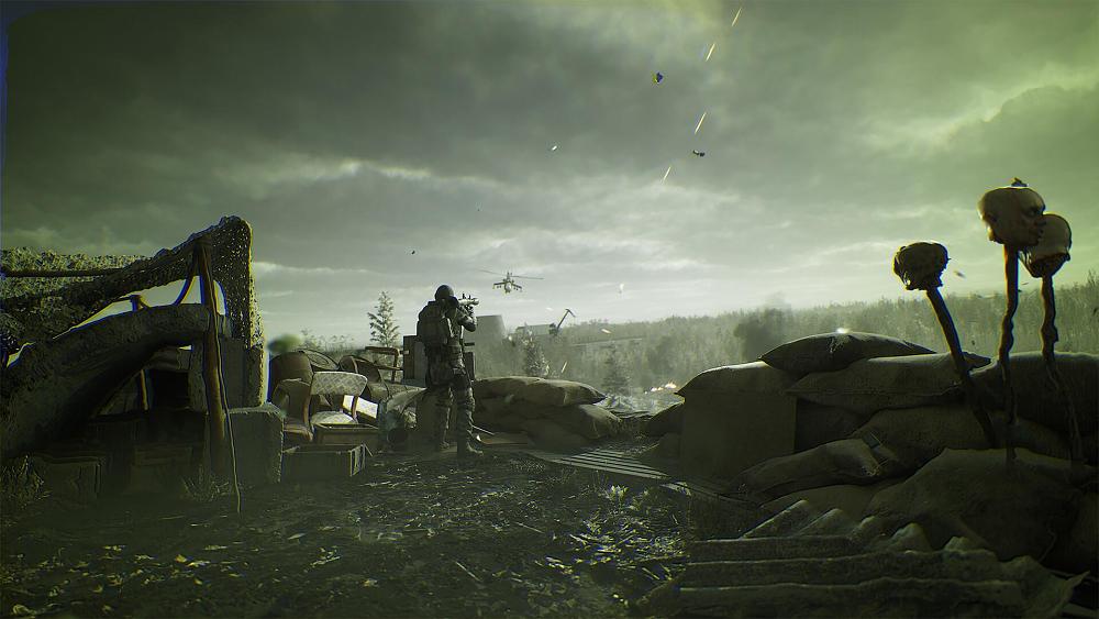Screenshot from STALKER 2: Heart of Chornobyl showing a wasteland, and a man with an RPG aimed at a helicopter.