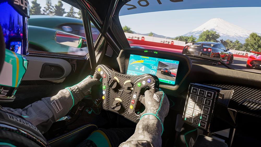 A screenshot showing the inside of a racecar during a race with the driver shown on the left side of the image.
