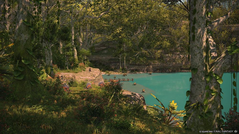 Image from the benchmark for Final Fantasy 14 showing a forested area surrounding a blue lake.